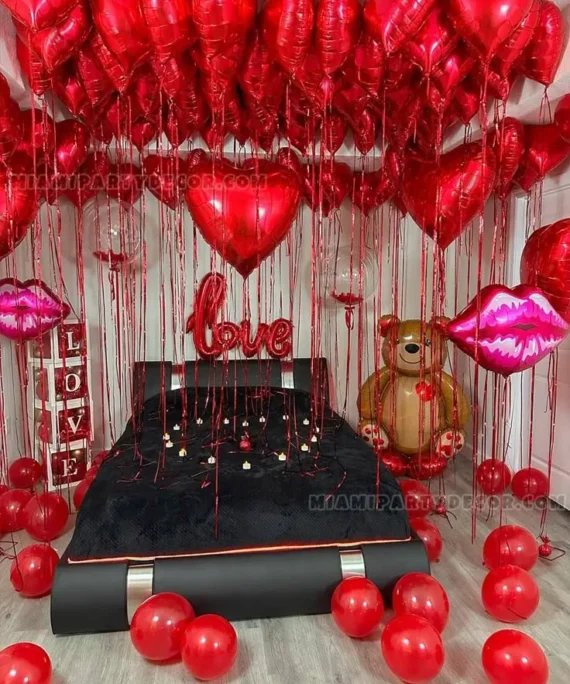 Valentine’s Day balloon decoration with red heart helium balloons, 6 large heart foil balloons, teddy foil, 2 kiss foil balloons, love boxes, 2 helium bobo balloons, floor balloons, and love foil balloon in Dubai, UAE by Event Experts.