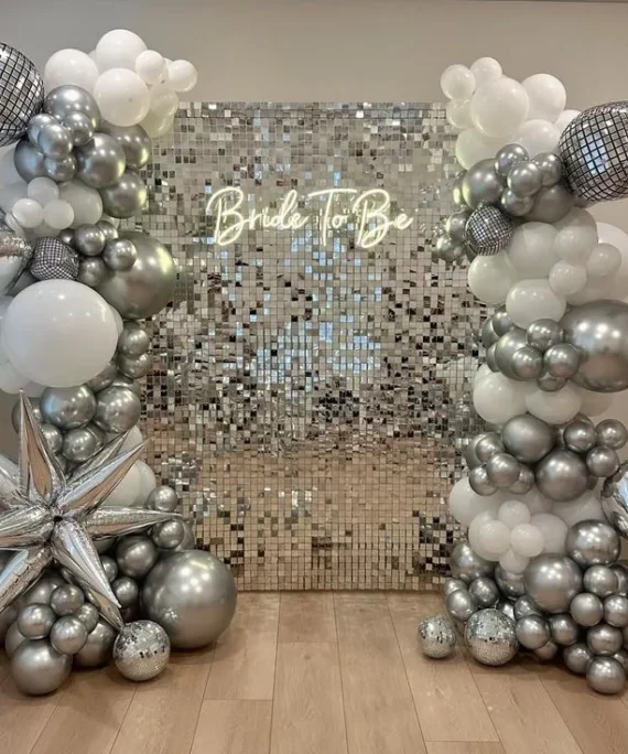 Bride to be silver shimmer backdrop balloon decoration with silver and white balloons, star balloons, bride to be banner and big silver balloons by Event Experts UAE in Dubai Abu Dhabi Sharjah Ajman Ras Al Khaimah Fujairah Umm Al Quwain
