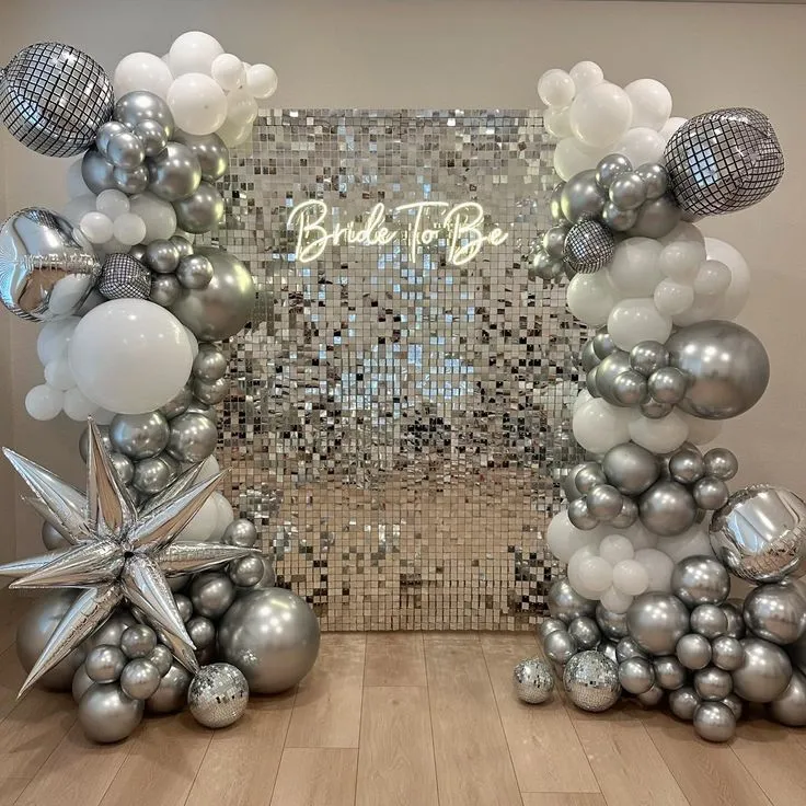 Bride to be silver shimmer backdrop balloon decoration with silver and white balloons, star balloons, bride to be banner and big silver balloons by Event Experts UAE in Dubai Abu Dhabi Sharjah Ajman Ras Al Khaimah Fujairah Umm Al Quwain