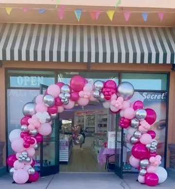 Office and shop opening balloon arch decoration with hot pink pastel pink silver and white balloons and red carpet entrance by Event Experts UAE in Dubai Abu Dhabi Sharjah Ajman Ras Al Khaimah Fujairah Umm Al Quwain