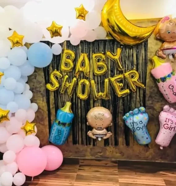 Baby shower half arch balloon decoration with light blue light pink and white balloons, baby shower foil, baby foil, bottle foil, small star balloons and black backdrop by Event Experts UAE in Dubai Abu Dhabi Sharjah Ajman Ras Al Khaimah Fujairah Umm Al Quwain