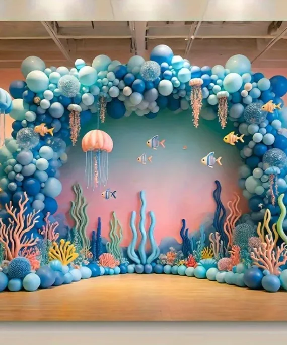 Baby shark theme balloon decoration setup with blue shade balloons, fish cutouts and ocean backdrop banner by Event Experts UAE