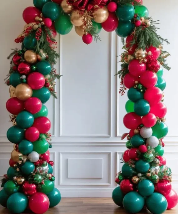 Christmas balloons garland arch decoration with red, green, gold, and white balloons, festive garlands, and luxury Christmas party décor.