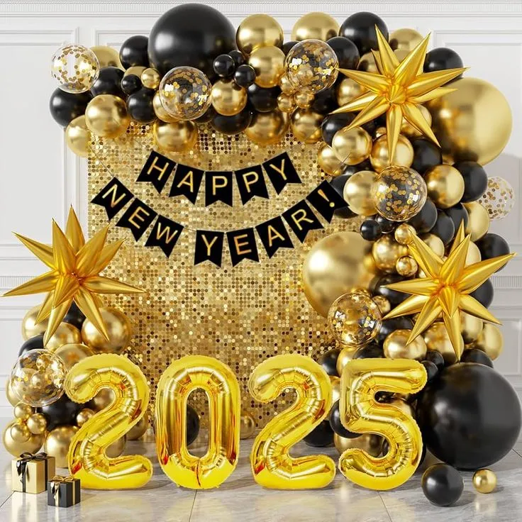 Happy New Year 2027 golden shimmer balloon decoration setup with black, gold, and transparent confetti balloons, gold foil star balloons, 2027 number foil balloons, Happy New Year silver foil banner, floor balloons, and white round cake table.